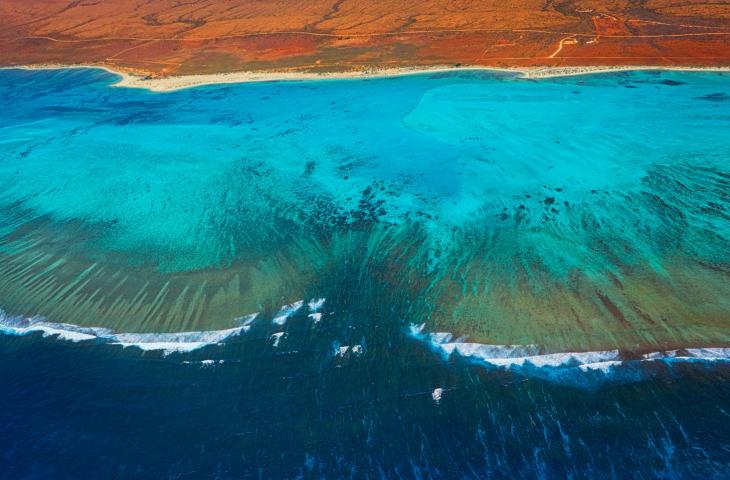 I cambiamenti climatici consumano le coste australiane – In a Bottle