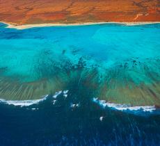 I cambiamenti climatici consumano le coste australiane – In a Bottle